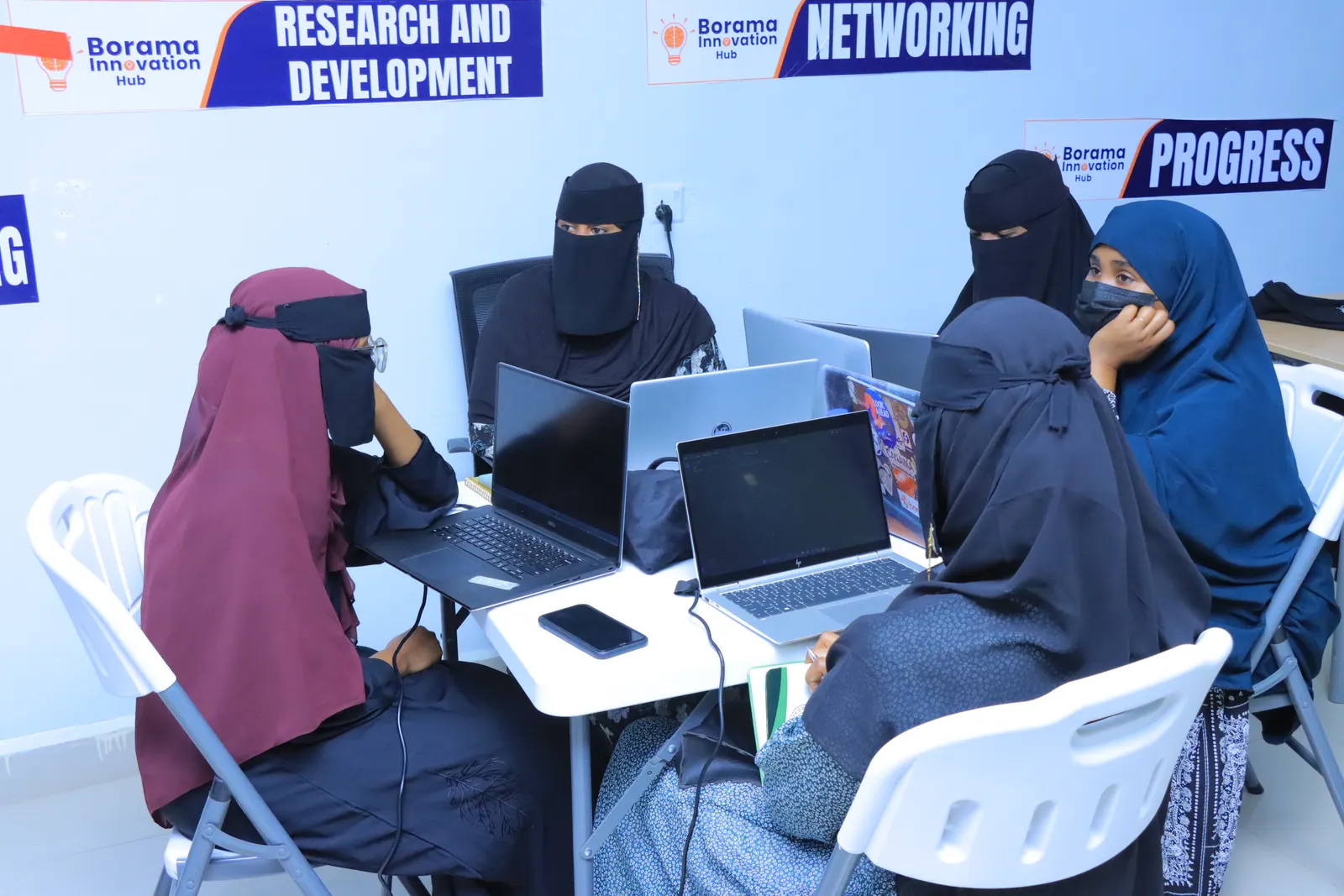 Students coding together during a Hadaf Tech bootcamp session