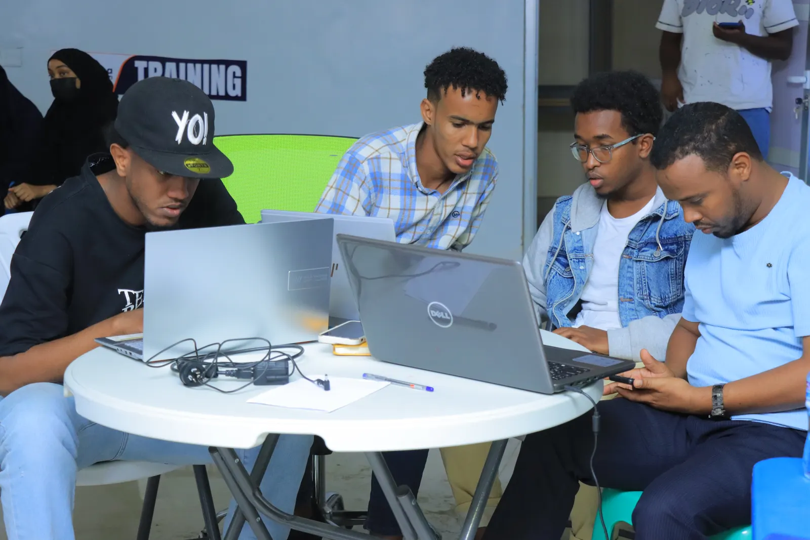 Bootcamp participants collaborating on laptops at the Borama Innovation Hub